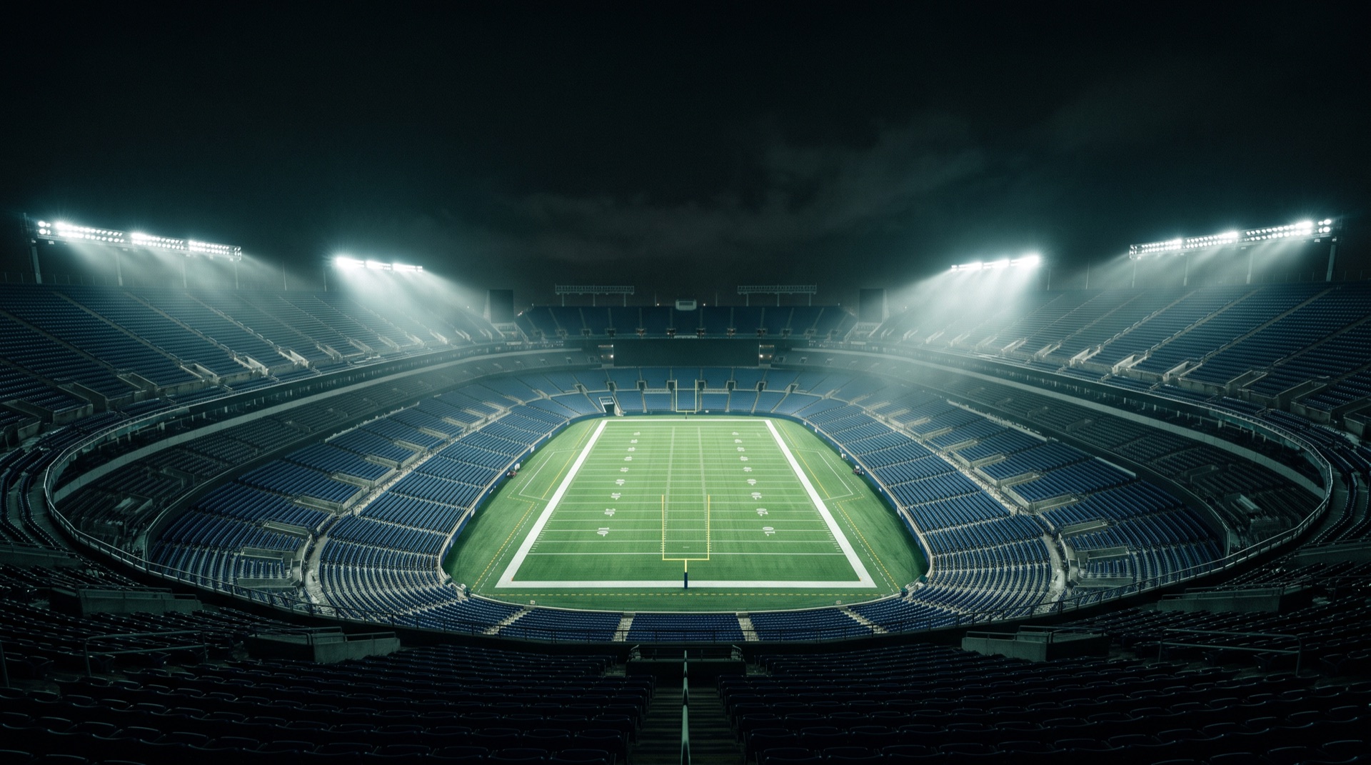 Football stadium at night under floodlights